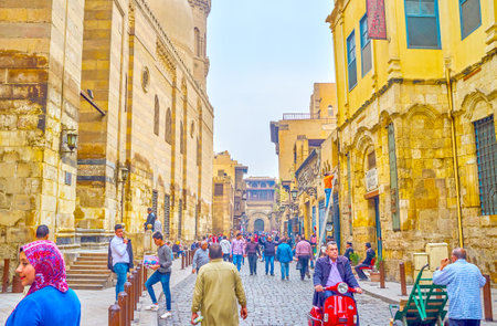 CAIRO, EGYPT - DECEMBER 20, 2017: The historic Al-Muizz street in Islamic neighborhood with main religion landmarks of old Cairo, on December 20 in Cairo.のeditorial素材