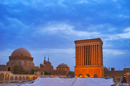 Watch the domes of Alexander's Prison, Maghbareh-ye Davazdah Imam (Twelve Imams) Mausoleum and illuminated medieval badgir, Yazd, Iran.の写真素材