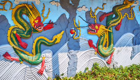 YANGON, MYANMAR - FEBRUARY 17, 2018: The old dragon relief on the wall of Long Shan Tang Clan Temple, on February 17 in Yangon.のeditorial素材