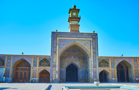 Visit stunning Seyed Mosque with large Sahn, scenic portals, clock tower and arcades, covered with...