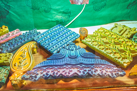 Special stamps of different forms and imprint design are used for producing traditional Persian stamped textile - ghalamkar, Isfahan, Iranの写真素材