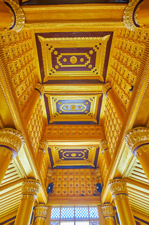 BAGO, MYANMAR - FEBRUARY 15, 2018: The ornate wooden ceiling in Lion Throne Hall (Great Audience Hall) of Kanbawzathadi Golden palace with carved patterns, on February 15 in Bago.のeditorial素材