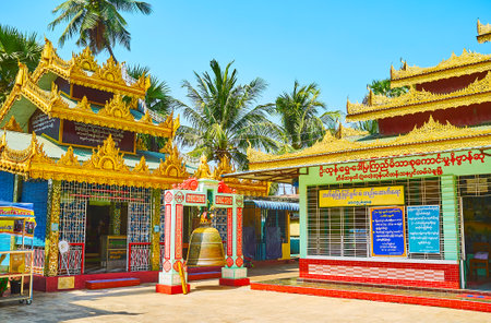 BAGO, MYANMAR - FEBRUARY 15, 2018: The large Bell for the religious ritual stands in front of the shrine of Shwemawdaw Pagoda, on February 15 in Bago.のeditorial素材