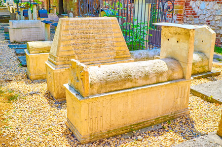 KRAKOW, POLAND - JUNE 21, 2018: The variety of forms and decorations of medieval tombstones in Old Jewish Cemetery in Kazimierz neighborhood, on June 21 in Krakowのeditorial素材