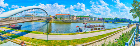 KRAKOW, POLAND - JUNE 21, 2018: Panorama of Kurlandzki Boulevard at the bank of Vistula river with...