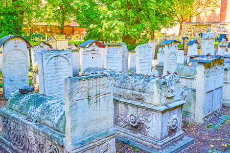 KRAKOW, POLAND - JUNE 21, 2018: The Old Jewish (Remuh, Remah) Cemetery, located adjacent to Remuh Synagogue, is one of the main landmarks and pilgrimage sites of Kazimierz neighborhood, on June 21 in Krakowのeditorial素材