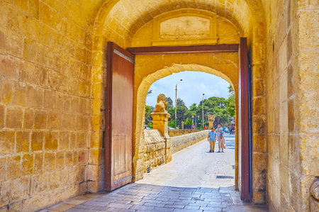 MDINA, MALTA - JUNE 16, 2018: The exit from the Mdina Fortress through the Main (Vilhena) Gate,...