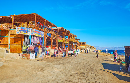DAHAB, EGYPT - DECEMBER 16, 2017: The small tourist bazaar  with sport equipment, souvenirs and foods, located in in Blue Hole snorkeling spot, on December 16 in Dahab.のeditorial素材