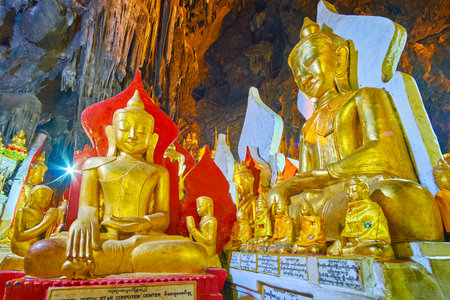 PINDAYA, MYANMAR - FEBRUARY 19, 2018:  The scenic Buddha images in Pindaya cave are decorated with gilding, relief patterns, ornamental textile and painted detailsのeditorial素材