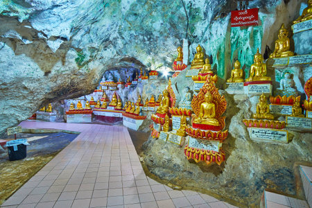 PINDAYA, MYANMAR - FEBRUARY 19, 2018:  The narrow tunnel in lower cave of Pindaya complex, created by flowing water, nowadays became the venerated Buddhist templeのeditorial素材