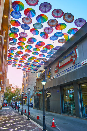 TEHRAN, IRAN - OCTOBER 10, 2017: The Tamaddon shopping street is decorated with colorful umbrellas, protecting of sun and creating cozy atmosphere for pedestriansのeditorial素材