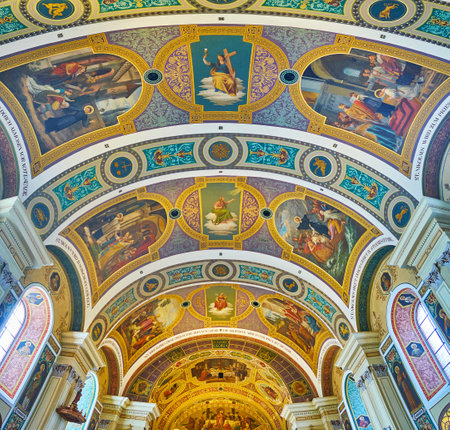 BAD ISCHL, AUSTRIA - FEBRUARY 20, 2019: The scenic frescoes on vault of St Nicholas Parish Church with icons, saints' life scenes and floral ornaments, on February 20 in Bad Ischlのeditorial素材