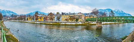 Enjoy the riverside panorama with highland Traun river, old mansions of Bad Ischl, city bridge and Mount Katrin, Salzkammergut, Austriaの写真素材