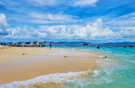 PHUKET, THAILAND - MAY 1, 2019: Amazing white sand beach of Khai Nai island with a view on moored speed boats and watercrafts, on May 1 on Phuketのeditorial素材