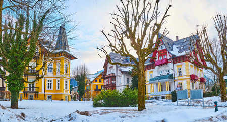 Enjoy the scenic winter garden in Kurhausstrasse, surrounded by traditional historical mansions, Bad Ischl, Salzkammergut, Austriaのeditorial素材