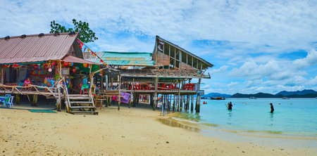 PHUKET, THAILAND - MAY 1, 2019: Traditional stilt huts serve as the lounge zone for the holidaymakers, enjoying beches of Khai Nai island and reefs of Andaman sea, on May 1 on Phuketのeditorial素材