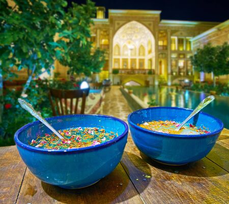 Relax on summer terrace of evening restaurant and try refreshing rose-saffron water with spices,...