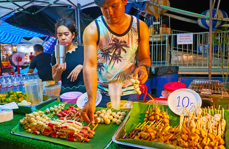 AO NANG, THAILAND - APRIL 27, 2019: The grilled seafood on skewers is traditional snack, popular among tourists and locals, Ao Nang Night Market, on April 27 in Ao Nangのeditorial素材