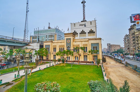 CAIRO, EGYPT - DECEMBER 22, 2017: The small park with green lawn if front of Railway Museum in Ramses Square, on December 22 in Cairo.のeditorial素材