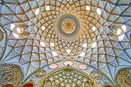 KASHAN, IRAN - OCTOBER 23, 2017: The  Borujerdi Historical House boasts ornate interior with traditional Persian decorations - muqarnas dome, painted and tile patterns, fine stucco reliefs, on October 23 in Kashan.のeditorial素材