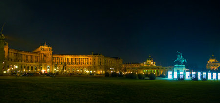 VIENNA, AUSTRIA - FEBRUARY 18, 2019: The night panoramic view on  Hofburg Palace with large Heldenplatz (Heroes Sqaure) with illuminated statue of Archduke Charles, on February 18 in Viennaのeditorial素材