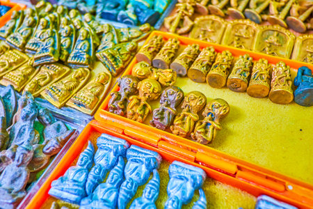 The small stone amulets on buddhist theme are a fine gift from Thailand, Bangkok Amulet Marketのeditorial素材