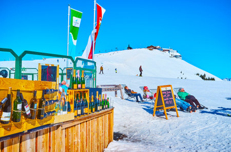 ZELL AM SEE, AUSTRIA - FEBRUARY 28, 2019: The open air lounge bar on the top of Schmitten mount offers large amount of famous alcohol drinks, on February 28 in Zell Am See.のeditorial素材