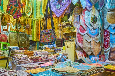 The souvenir stall with silk tapestries, dinner napkins, pillowcases, female bags, tablecloths and...