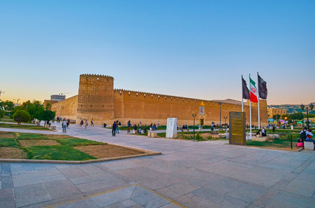 SHIRAZ, IRAN - OCTOBER 14, 2017: The sunset sky over the historical Karim Khan citadel,  located in Shohada square in downtown, on October 14 in Shiraz.のeditorial素材