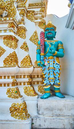 The scultpure of Yaksha mythical creature, holding club and guarding Wat Chedi Luang temple complex, Chiang Mai, Thailandの写真素材