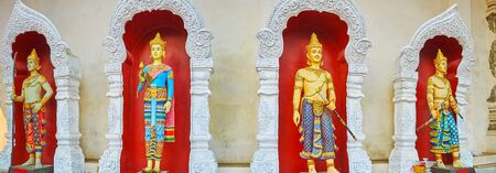 Panorama of the colored statues, located in niches on the backside of the Main Viharn Hall of Wat...