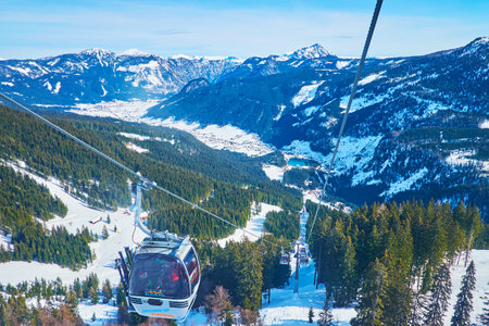 GOSAU, AUSTRIA - FEBRUARY 26, 2019: Panorama Jet Zwieselalm cable car is nice place to ride and enjoy the scenery of Dachstein West Alps, on February 26 in Gosauのeditorial素材