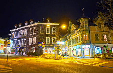 BAD ISCHL, AUSTRIA - FEBRUARY 26, 2019: The evening illumination of classical buildings in Salzburger strasse, on February 26 in Bad Ischlのeditorial素材