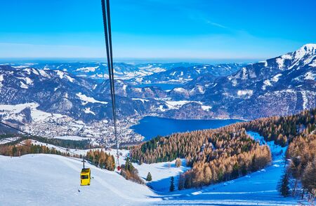Zwolferhorn cable car is the most popular tourist attraction in St Gilgen, the steep mountain slope opens the view on Wolfgangsee lake and spectacular Alpine scenery, Salzkammergut, Austriaの写真素材
