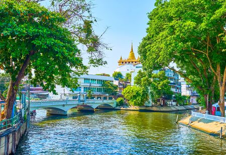 The beautiful view on confluence of two khlongs (canals) in central district and magnificent Golden Mount Temple on the background, Bangkok, Thailandの写真素材