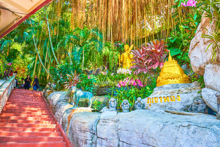 BANGKOK, THAILAND - APRIL 24, 2019: The staircase to the Wat Saket (Golden Mount Temple) with scenic sculptures above the banyan trees on the hill, on April 24 in Bangkokのeditorial素材