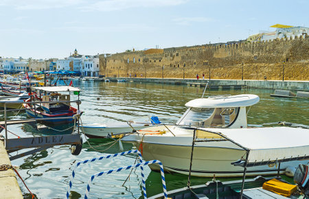 BIZERTE, TUNISIA - SEPTEMBER 4, 2015: Historical cityscape from the port of Bizerte with many...