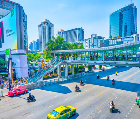 BANGKOK, THAILAND - APRIL 24, 2019: The covered skywalks in modern Ratchaprasong district is a very comfortable way to move between main shopping malls above busy roads, on April 24 in Bangkokのeditorial素材