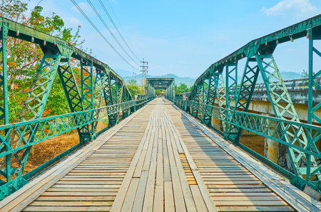 Walk historical Saphan Prawatsart or Memorial Bridge, built during the World War II across the Pai river, Thailandのeditorial素材