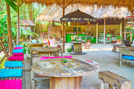 CHIANG MAI, THAILAND - MAY 5, 2019: The scenic lounge cafe of Poopoopaper park with bamboo canopy, wooden furniture and handmade decorations, on May 5 in Chiang Maiのeditorial素材