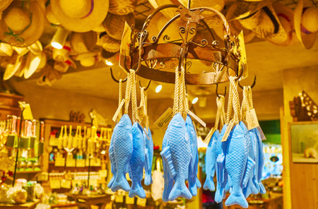 HALLSTATT, AUSTRIA - FEBRUARY 25, 2019: The blue fish shaped soap is hanging on the vintage round rack in old Salzkontor store, famous for high quality natural skincare and healthcare goods with mountain salt, on February 25 in Hallstattのeditorial素材