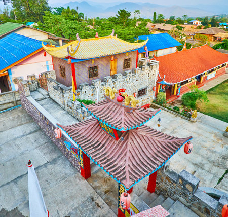 SANTICHON, THAILAND - MAY 5, 2019: The tile sweeping roofs of the fortress buildings in Chinese Cultural Center of tea village, on May 5 in Santichonのeditorial素材