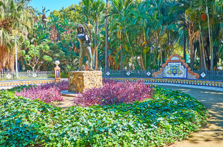 MALAGA, SPAIN - SEPTEMBER 26, 2019: Malaga park is decorated with Andalusian style court containing monument of Verdiales festival singer and musician, named fiestero, on September 26 in Malagaのeditorial素材