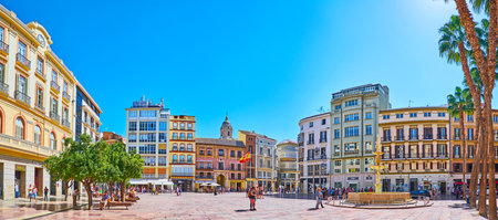 MALAGA, SPAIN - SEPTEMBER 26, 2019: Panoramic view of Plaza de la Constitucion (Constitution Square) with Genoa Fountain amid historical buildings, on September 26 in Malagaのeditorial素材