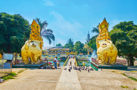 YANGON, MYANMAR - FEBRUARY 17, 2018: The view from behind of chinthe lions statues of Maha Wizaya (Mahavijaya) Pagoda, on February 17 in Yangonのeditorial素材