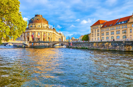 BERLIN, GERMANY - OCTOBER 3, 2019: The Spree river forks at the Museum Island with impressive Bode Museum building on its end, on October 3 in Berlinのeditorial素材