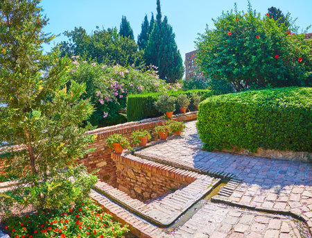 The system of water jets in topiary garden of Alcazaba fortress, Malaga, Spainのeditorial素材