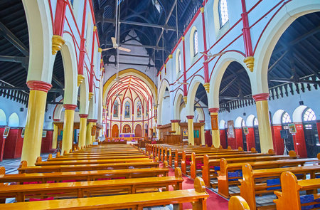 YANGON, MYANMAR - FEBRUARY 17, 2018: The modest prayer hall of Holy Trinity Anglican Church with timber ceiling, arcades and plaster decors, on February 17 in Yangonのeditorial素材