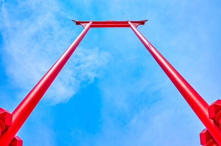 The amazing red timber Giant Swing is one of the most famous landmarks of Bangkok, Thailandの写真素材