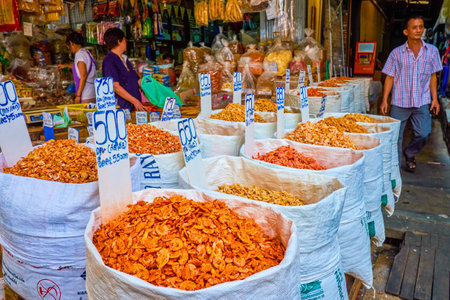 BANGKOK, THAILAND - APRIL 15, 2019: The large bags of dried shrimps and other seafood on the Chinatown's market stall, on April 15 in Bangkokのeditorial素材